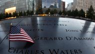 A US flag is placed on a name on the memorial at the National September 11 Memorial and Museum in Lower Manhattan in New York City, US, September 9, 2016. Reuters/Brendan McDermid