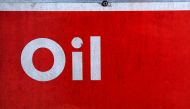 The word oil is pictured on an oil bank at a recycling yard in London. (REUTERS/Stefan Wermuth/File Photo)