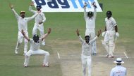 India's Ravindra Jadeja (C) appeals successfully for LBW for the wicket of Zealand's Ish Sodhi (2R) with captain Virat Kohli (L) and other teammates during the third day of the first Test match between India and New Zealand at Green Park Stadium in Kanpur