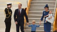 (L-R) Prince William, Duke of Cambridge, Prince George of Cambridge, Catherine, Duchess of Cambridge and Princess Charlotte of Cambridge arrive at 443 Maritime Helicopter Squadron on September 24, 2016 in, Victoria, British Columbia. AFP / Don MacKinnon