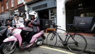 An UberEATS food delivery courier waits for an order in London, Britain September 7, 2016. (REUTERS/Neil Hall)