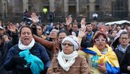 Members of a Colombian mega church pray for their country ahead a final referendum on a peace to finish the guerrilla war between the The Revolutionary Armed Forces of Colombia—People's Army (FARC) and the state, the longest-running armed conflict which h