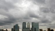 Storm clouds are seen above the Canary Wharf financial district in London, Britain. Reuters/Greg Bos/File Photo