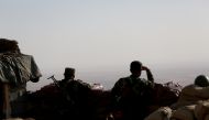 Soldiers wait at Mount Zertik as Peshmerga forces attack Islamic State positions with howitzers at the entrance of the entrance of the Mosul, in Nineveh, Iraq on October 2, 2016. ( Yunus Kele? - Anadolu Agency )