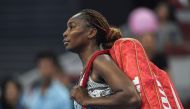 Venus Williams of the US leaves the court after losing to China's Peng Shuai in their women's singles first round match at the China Open tennis tournament in Beijing on October 3, 2016. / AFP / FRED DUFOUR
