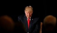 Republican presidential nominee Donald Trump pauses before answering questions at the 
