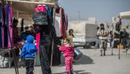 Syrians who have returned to the Syrian town of Jarabulus, following its cleansing of Daesh militants as part of Operation Euphrates Shield, do their shopping at a bazaar on October 3, 2016. (Halil Fidan - Anadolu Agency)