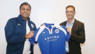 Ivan Bravo, Director General of Aspire Academy (right) receives a kit from a representative from Burrda Sport during a ceremony held at the Amsterdam ArenA, yesterday. 
