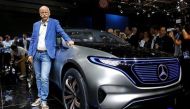 Dieter Zetsche, CEO of Daimler and Head of Mercedes-Benz, poses in front of a Mercedes EQ Electric car at the Mondial de l'Automobile, the Paris auto show, in Paris, France, September 29, 2016. REUTERS/Jacky Naegelen/File Photo