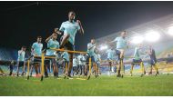 Qatari players taking part in a training session in Suwon yesterday.