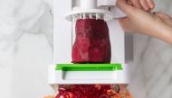 A beet, a sweet potato and a celery root emerge from the spiralizer as zoodles, which have become popular as a substitute for pasta. (Photo by Goran Kosanovic for The Washington Post)