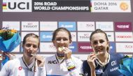 From left: Italy’s silver medallist Lisa Morzenti, gold medallist Karlijn Swinkels of the Netherlands, and France’s bronze medallist Juliette Labous celebrate on the podium at the end of the women’s junior Individual Time Trial event.