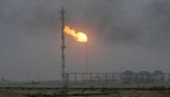 Flames emerge from a pipeline at the oil fields in Basra, southeast of Baghdad, September 30, 2016. REUTERS/Essam Al-Sudani.