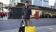 Chinese tourist Jasper Zhang poses for a portrait on New Bond Street in London, Britain October 5, 2016. REUTERS/Neil Hall