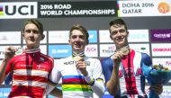 Gold medal winner Brandon Mcnulty (centre) of the US, silver medallist Mikkel Bjerg (left) of Denmark and bronze medallist Ian Garrison of the US celebrate on the podium at the end of the men’s junior individual time trial event as part of the 2016 UCI Ro