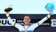 Germany’s Tony Martin celebrates on the podium after winning the gold medal at the end of the men’s elite individual time trial event in Doha