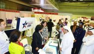Minister of Education and Higher Education H E Dr Mohammed Abdul Wahed Ali Al Hammadi speaking to Dana Shell Smith, US Ambassador to Qatar, at the universities fair at the Qatar National Convention Center yesterday, as Student Advisor, Public Affairs Sect