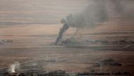 Smoke rises at Mosul's Bertela region after coalition forces' air-strike over Deash targets during an operation to retake Iraq's Mosul from Deash in Iraq on October 17, 2016. (Yunus Kele? - Anadolu Agency)