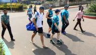 England cricket captain Alastair Cook (centre L) walks back to the hotel after practice in Chittagong on October 18, 2016, ahead of the first Test match against Bangladesh on October 20. (AFP)