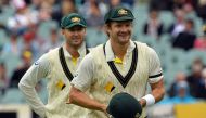 This file photo taken on December 9, 2013 shows Australia's cricketer Shane Watson (R) and captain Michael Clarke walking towards fielding positions during the final day of the second Ashes cricket Test match against England in Adelaide. AFP / SAEED KHAN 