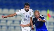 Al Kharaitiyat’s Mahmoud Saad Abdelhalim (left) vies for the ball with Al Khor’s Madson Formagini during their Qatar Stars League match played at Al Khor Stadium yesterday. 