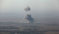 Smoke rises at Islamic State militants' positions in the town of Naweran near Mosul, Iraq, October 23, 2016. Reuters/Azad Lashkari