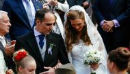 Prince Mihailo Karadjordjevic (L) and his bride Ljubica Ljubisavljevic exit after their wedding ceremony at the St. George's Church in Oplenac, near the central Serbian town of Topola, on October 23, 2016. Prince Mihajlo Karadjordjevic's wedding on Octobe