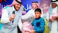A Syrian child receiving gifts from RAF officials.