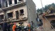 Rescue workers search at site after an explosion hit a town in Fugu county, Shaanxi province, China, October 24, 2016. China Daily/via REUTERS