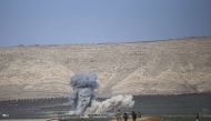 Smoke rises after coalition forces' airstrike over Islamic State targets as Iraqi Kurdish Regional Government's peshmerga forces attack to capture Nawaran Village and the other surrounding villages from IS terrorists during the operation to retake Iraq's 