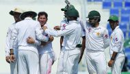 Pakistan spinner Yasir Shah (third left) celebrates with team-mates after taking the wicket of the West Indies’ captain Jason Holder (unseen) on the final day of the second Test at the Sheikh Zayed Cricket Stadium in Abu Dhabi yesterday.