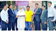 Sayed Musharaf Ali Haroon, winner of the ‘Delightful Diwali’ campaign by Malabar Gold & Diamonds receives 500 gold coins from Santhosh T V — Regional Head, in the presence of officials from Malabar Gold & Diamonds.
