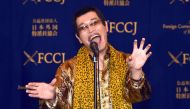 Japanese comedian Pikotaro performs during a press conference at the Foreign Correspondents' Club of Japan in Tokyo on October 28, 2016. AFP / KAZUHIRO NOGI
