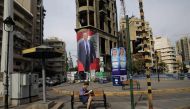 A giant poster that bears the portrait of Lebanese presidential candidate Michel Aoun is seen hanging of a building in Sassine square in Beirut's Ashrafieh neighbourhood on October 28, 2016.  AFP / JOSEPH EID
