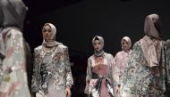 Models present creations by Indonesian designer Anniesa Hasibuan during Jakarta Fashion Week in Jakarta on October 28, 2016. (AFP / GOH CHAI HIN)