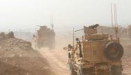 Peshmerga military vehicles drive north of Mosul during the operation to retake the city. / Reuters: Ari Jalal.