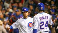 Chicago Cubs left fielder Ben Zobrist (left) is congratulated by center fielder Dexter Fowler (24) for scoring on a sacrifice fly by catcher David Ross (not pictured) against the Cleveland Indians during the fourth inning in game five of the 2016 World Se