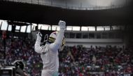 Mercedes AMG Petronas F1 Team British driver Lewis Hamilton, reacts after winning the Formula One Mexico Grand Prix at the Hermanos Rodriguez circuit, in Mexico City on October 30, 2016. / AFP / YURI CORTEZ

