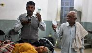 A woman, who according to local media was wounded in a shelling attack at the international border with Pakistan, is pictured inside a government hospital in Jammu, November 1, 2016. Reuters/Mukesh Gupta 