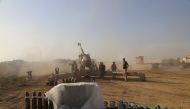 Soldiers of Iraqi Army use artillery to hit IS targets at the Bertilla front as the operation to retake Iraq's Mosul from IS terrorists continues, in Mosul, Iraq on November 1, 2016.  ( Hemn Baban - Anadolu Agency )