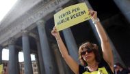 An Amnesty International activist holds a placard reading ''truth for Giulio Regeni'' as she takes part in a performance to protest against enforced disappearance in Rome, Italy July 13, 2016. REUTERS/Staff/File Photo