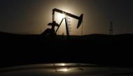 A pump jack is seen at sunrise near Bakersfield, California October 14, 2014. REUTERS/Lucy Nicholson.