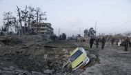 Afghan security forces and NATO troops arrive at the site of explosion near the German consulate office in Mazar-i-Sharif, Afghanistan November 11, 2016. REUTERS/Anil Usyan