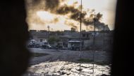 Smoke billows from Islamic State positions as a convoy from the Iraqi Special Forces 2nd division move into position during fighting in the eastern Samah area of Mosul on November 11, 2016. Elite Iraqi troops battled the Islamic State group in the streets