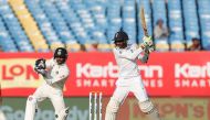 England's Haseeb Hameed plays a shot as India's wicketkeeper Wriddhiman Saha looks on. (REUTERS/Amit Dave)
