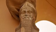 This file photo taken on April 09, 2013 shows a partial view of an ancient statue dated from the Assyrian civilization, at the archaeological site of Nimrud that lies on the Tigris River around 30 kilometres (18 miles) southeast of Mosul, Iraq's second ci