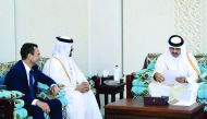 Emir H H Sheikh Tamim bin Hamad Al Thani receiving an invitation to take part in the Protection of World Cultural Heritage Conference from the UAE Ambassador to Qatar, Saleh Mohamed bin Nasra Al Amri, and Ambassador of France to Qatar, Eric Chevallier, ye