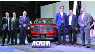 Mahmoud Skhiri (third left), General Manager- Sales at Mannai Trading Co; Markus Leithe, (third right) Managing Director, Middle East Commercial Operations at General Motors; and other officials during the launch of the All New GMC Acadia at Westin Hotel 