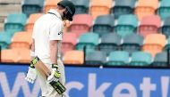Australia's captain Steven Smith walks off the field with his heads down following his dismissal off South Africa's paceman Kagiso Rabada on the fourth day's play of the second Test cricket match between Australia and South Africa in Hobart on November 15
