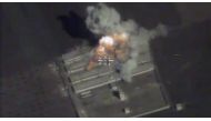 A still image taken from a drone footage and released by Russia's Defence Ministry on November 15, 2016, shows missiles hitting what Defence Ministry said was militants' ammunition warehouse at an unknown location in Syria. Ministry of Defence of the Russ